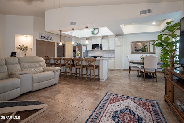 7317 Kiowa Creek Dr, El Paso, TX 79911 - living room with a tray ceiling and baseboards