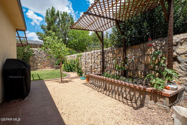 7317 Kiowa Creek Dr, El Paso, TX 79911 - fenced backyard with a grill and a pergola