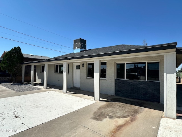 7216 Amethyst Rd, El Paso, TX 79915 - back of property featuring brick siding, a chimney, and a porch