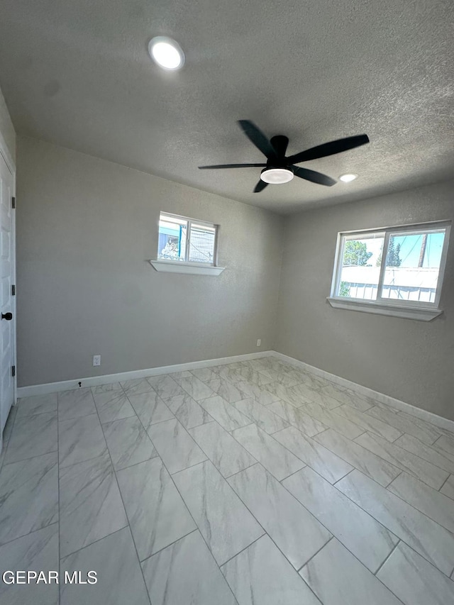 7216 Amethyst Rd, El Paso, TX 79915 - empty room featuring ceiling fan, light marble finish flooring, and a textured ceiling