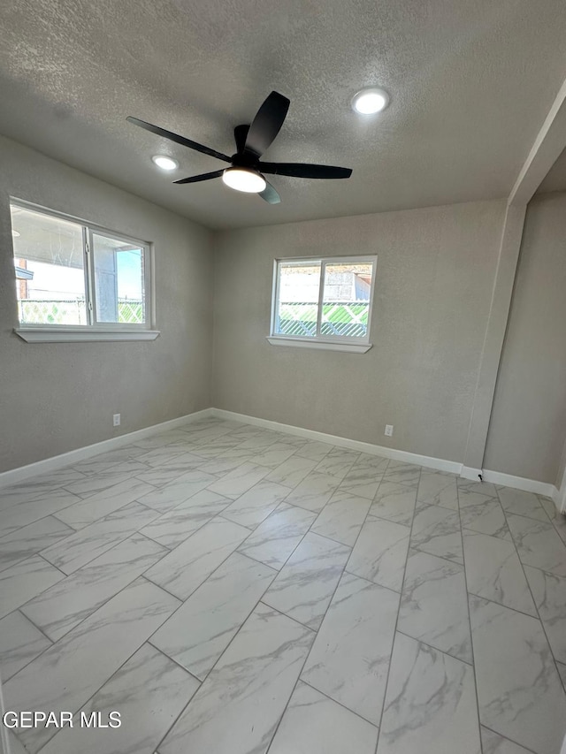 7216 Amethyst Rd, El Paso, TX 79915 - spare room featuring a textured ceiling, light marble finish flooring, ceiling fan, and recessed lighting