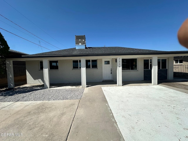 7216 Amethyst Rd, El Paso, TX 79915 - view of front of property with brick siding, a patio area, and roof with shingles