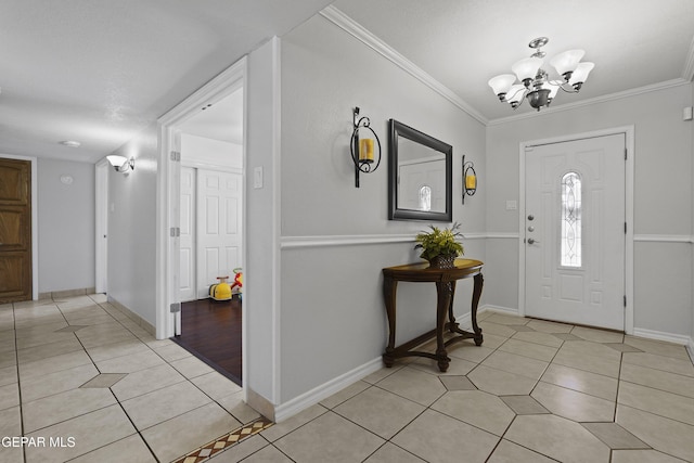 608 Paseo De Luna Ln, El Paso, TX 79912 - entrance foyer featuring light tile patterned flooring, a chandelier, and crown molding