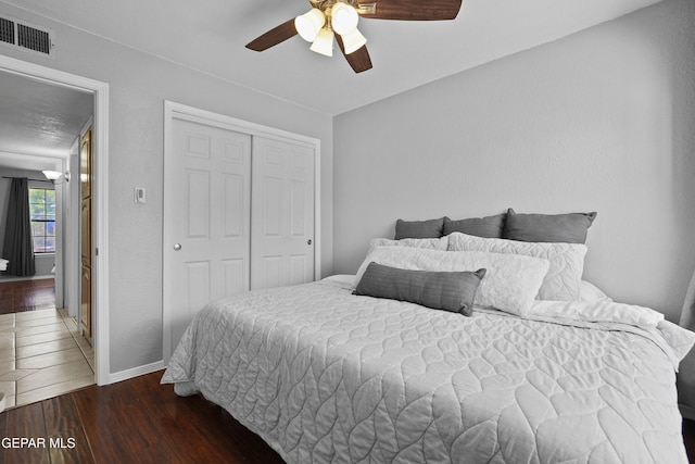 608 Paseo De Luna Ln, El Paso, TX 79912 - bedroom featuring a closet, wood finished floors, and ceiling fan