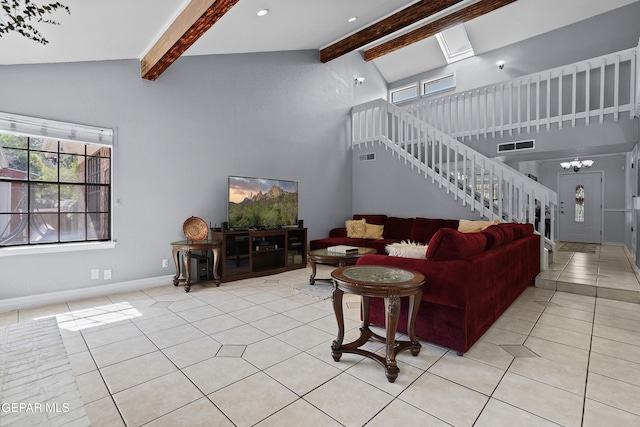 608 Paseo De Luna Ln, El Paso, TX 79912 - living room featuring stairway, light tile patterned floors, high vaulted ceiling, beam ceiling, and a chandelier