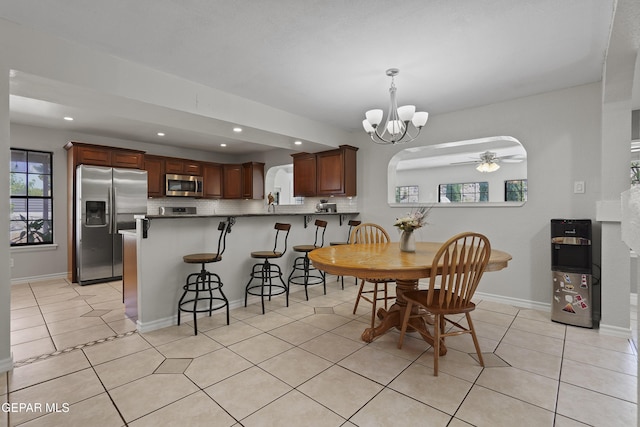 608 Paseo De Luna Ln, El Paso, TX 79912 - dining area featuring recessed lighting, a ceiling fan, healthy amount of natural light, light tile patterned flooring, and a chandelier