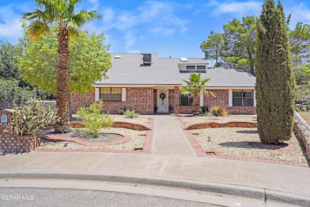 608 Paseo De Luna Ln, El Paso, TX 79912 - cape cod-style house featuring a shingled roof and brick siding
