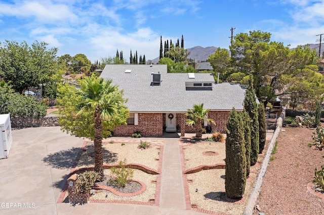 608 Paseo De Luna Ln, El Paso, TX 79912 - view of front facade with a shingled roof and brick siding