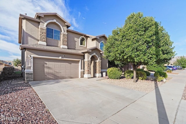 5020 Copper Ranch Ave, El Paso, TX 79934 - view of front facade with stone siding, stucco siding, an attached garage, and concrete driveway