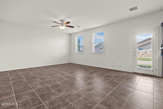 5020 Copper Ranch Ave, El Paso, TX 79934 - unfurnished room featuring dark tile patterned flooring and a ceiling fan