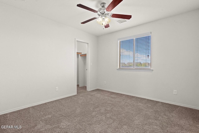 5020 Copper Ranch Ave, El Paso, TX 79934 - unfurnished bedroom featuring carpet flooring, a spacious closet, and a ceiling fan