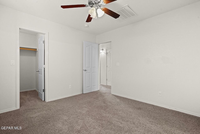 5020 Copper Ranch Ave, El Paso, TX 79934 - unfurnished bedroom featuring carpet flooring, a spacious closet, and a ceiling fan