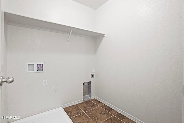 5020 Copper Ranch Ave, El Paso, TX 79934 - washroom with hookup for a washing machine, electric dryer hookup, and dark tile patterned flooring