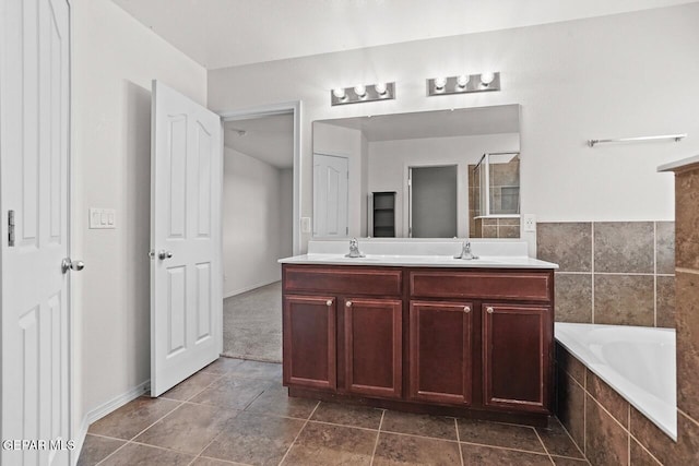 5020 Copper Ranch Ave, El Paso, TX 79934 - bathroom with tiled tub and double vanity