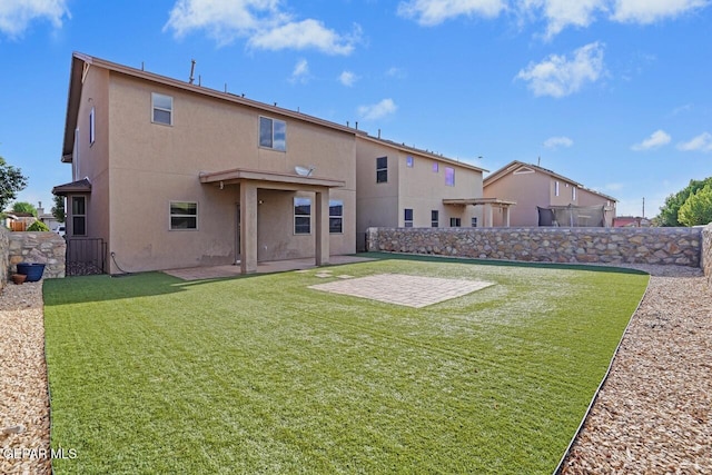 5020 Copper Ranch Ave, El Paso, TX 79934 - back of house with stucco siding, a patio, and a fenced backyard
