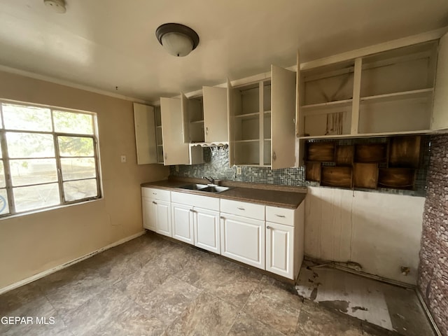 320 Edith Dr, El Paso, TX 79915 - kitchen featuring open shelves, dark countertops, tasteful backsplash, crown molding, and white cabinetry