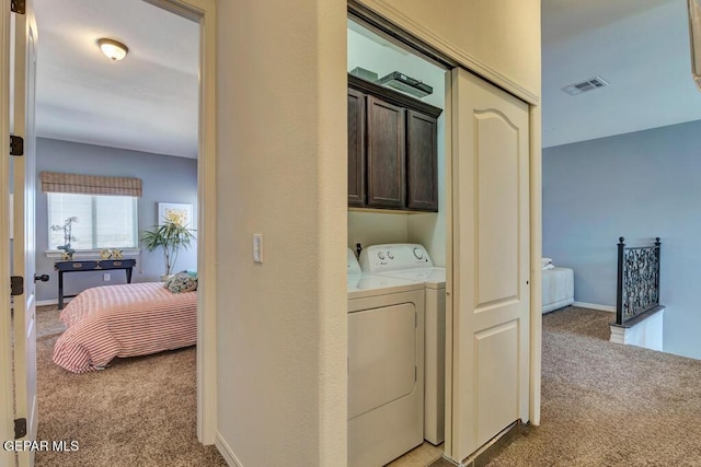 545 Lanner Dr, El Paso, TX 79928 - washroom with cabinet space, light carpet, and separate washer and dryer