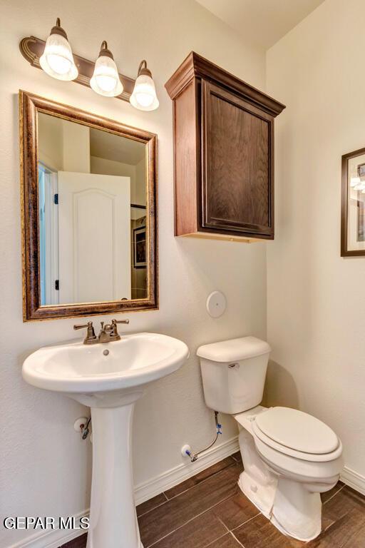 545 Lanner Dr, El Paso, TX 79928 - bathroom with baseboards and toilet