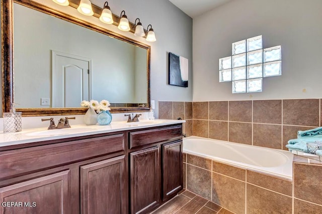 545 Lanner Dr, El Paso, TX 79928 - bathroom featuring double vanity and a bath
