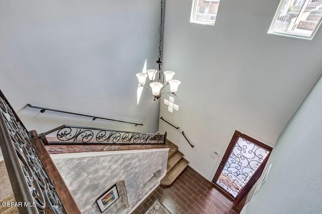 545 Lanner Dr, El Paso, TX 79928 - stairs with a chandelier and tile patterned floors