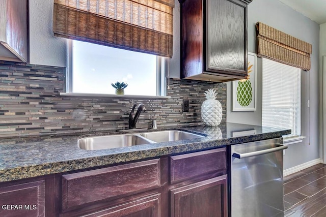 545 Lanner Dr, El Paso, TX 79928 - kitchen with stainless steel dishwasher, tasteful backsplash, and dark stone countertops