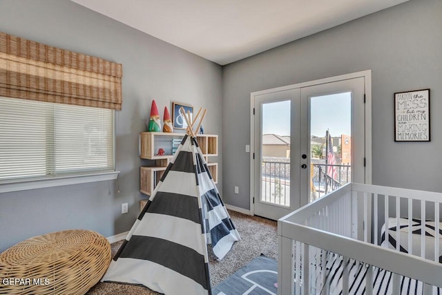 545 Lanner Dr, El Paso, TX 79928 - carpeted bedroom featuring french doors, multiple windows, and access to outside