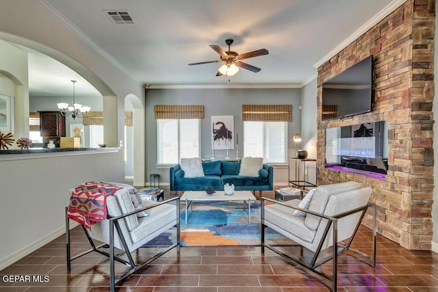 545 Lanner Dr, El Paso, TX 79928 - living area featuring ceiling fan, a chandelier, ornamental molding, and arched walkways