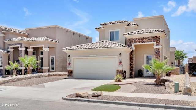 14192 Earl Chokiski, El Paso, TX 79938 - view of front of home with an attached garage, stucco siding, a tile roof, driveway, and stone siding