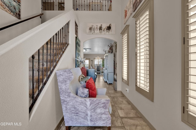 14192 Earl Chokiski, El Paso, TX 79938 - foyer entrance featuring arched walkways, stairs, and a towering ceiling