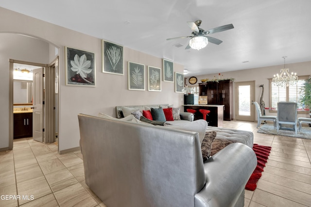 14192 Earl Chokiski, El Paso, TX 79938 - living area with arched walkways, a ceiling fan, and a chandelier