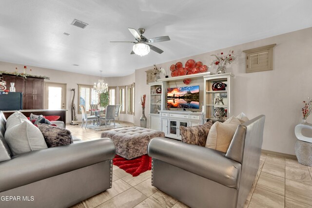 14192 Earl Chokiski, El Paso, TX 79938 - living area with a ceiling fan and a chandelier