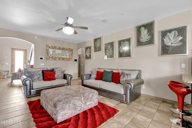 14192 Earl Chokiski, El Paso, TX 79938 - living area with arched walkways and a ceiling fan