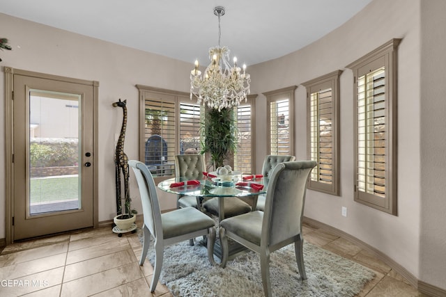 14192 Earl Chokiski, El Paso, TX 79938 - dining space with healthy amount of natural light, a chandelier, and light tile patterned floors