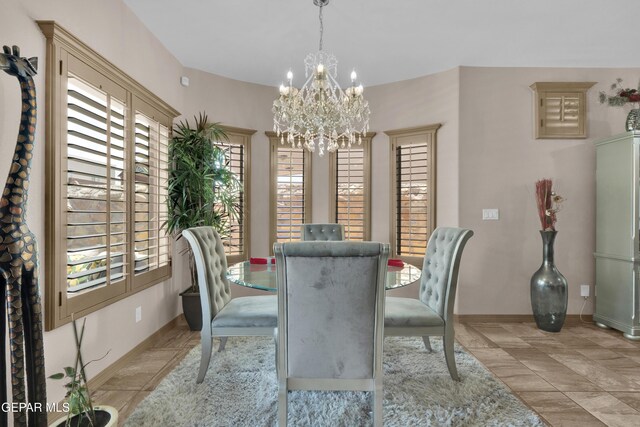 14192 Earl Chokiski, El Paso, TX 79938 - dining room featuring healthy amount of natural light and a chandelier