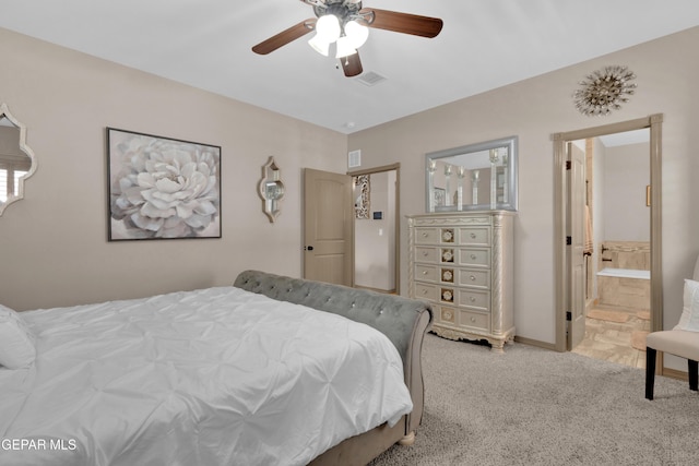 14192 Earl Chokiski, El Paso, TX 79938 - bedroom featuring light colored carpet, ensuite bath, and a ceiling fan