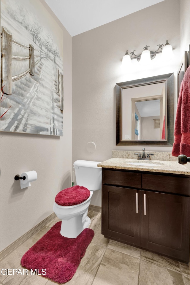 14192 Earl Chokiski, El Paso, TX 79938 - half bathroom featuring toilet and vanity