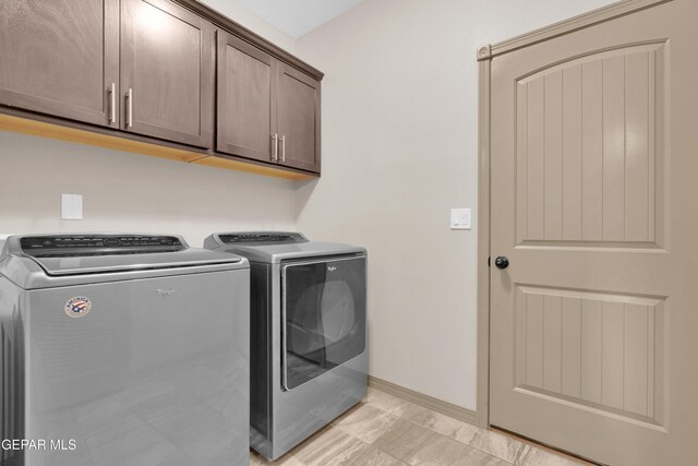 14192 Earl Chokiski, El Paso, TX 79938 - laundry room with cabinet space and separate washer and dryer