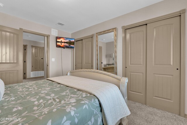 14192 Earl Chokiski, El Paso, TX 79938 - carpeted bedroom featuring two closets