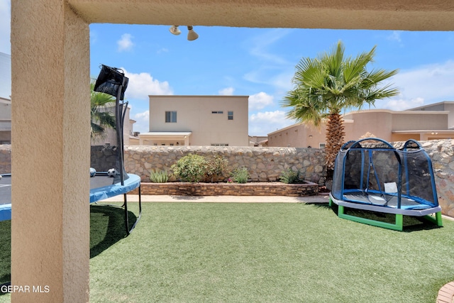 14192 Earl Chokiski, El Paso, TX 79938 - view of yard with a trampoline