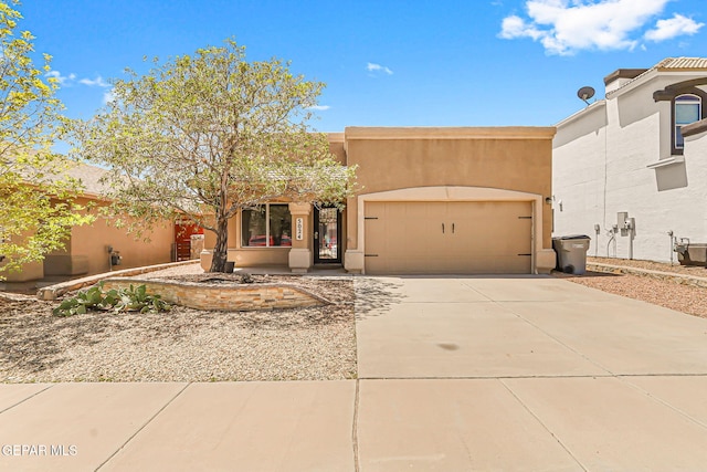 5024 Gold Ranch Ave, El Paso, TX 79934 - pueblo revival-style home featuring an attached garage, driveway, and stucco siding