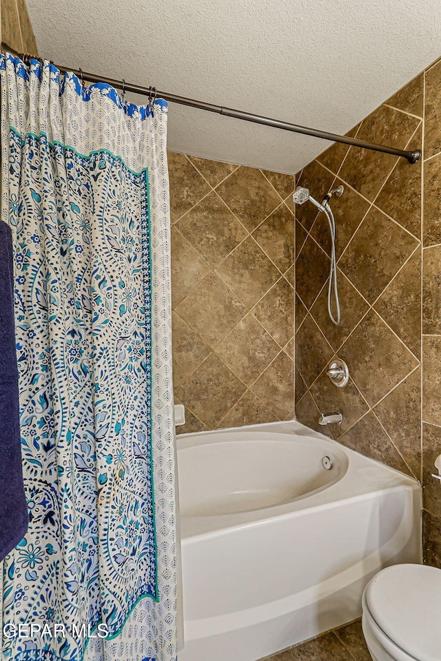 5024 Gold Ranch Ave, El Paso, TX 79934 - full bath featuring a textured ceiling and shower / bath combo with shower curtain