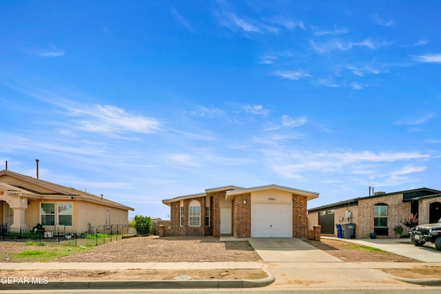 10980 Northampton St, El Paso, TX 79934 - single story home with brick siding, concrete driveway, and a garage