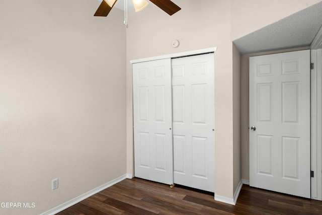 10980 Northampton St, El Paso, TX 79934 - unfurnished bedroom featuring dark wood-style floors, a closet, and a ceiling fan