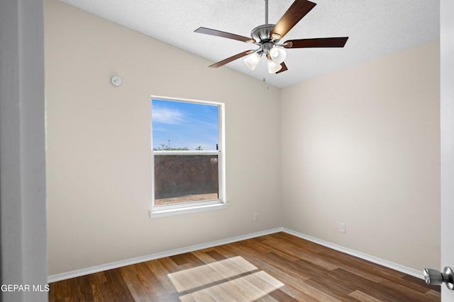 10980 Northampton St, El Paso, TX 79934 - unfurnished room with wood finished floors, vaulted ceiling, ceiling fan, and a textured ceiling