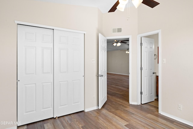 10980 Northampton St, El Paso, TX 79934 - unfurnished bedroom featuring wood finished floors, a closet, and a ceiling fan
