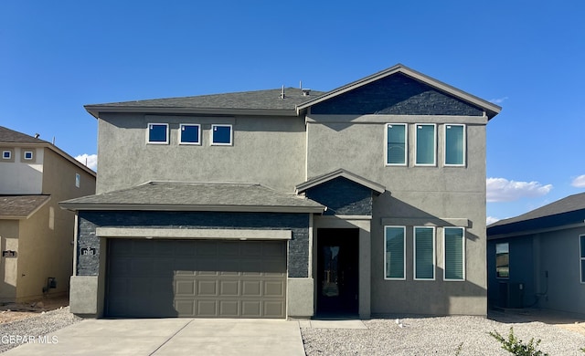3720 Hill Top Place, El Paso, TX 79938 - view of front of home featuring a garage, concrete driveway, and stucco siding