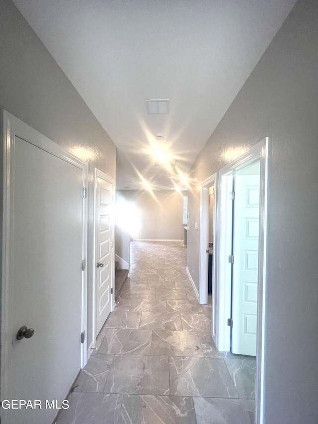 3720 Hill Top Place, El Paso, TX 79938 - hall with marble look tile flooring and vaulted ceiling