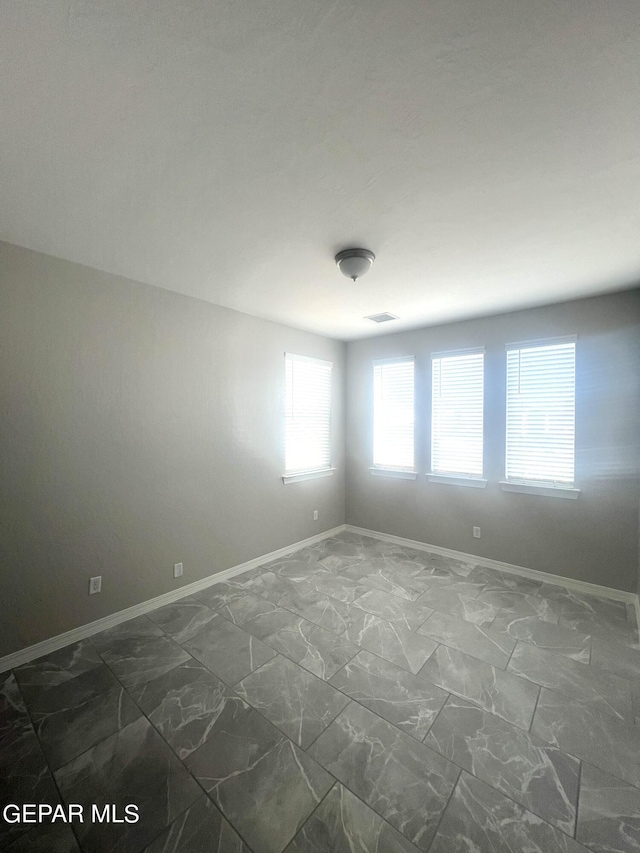 3720 Hill Top Place, El Paso, TX 79938 - empty room featuring dark marble finish floors and baseboards