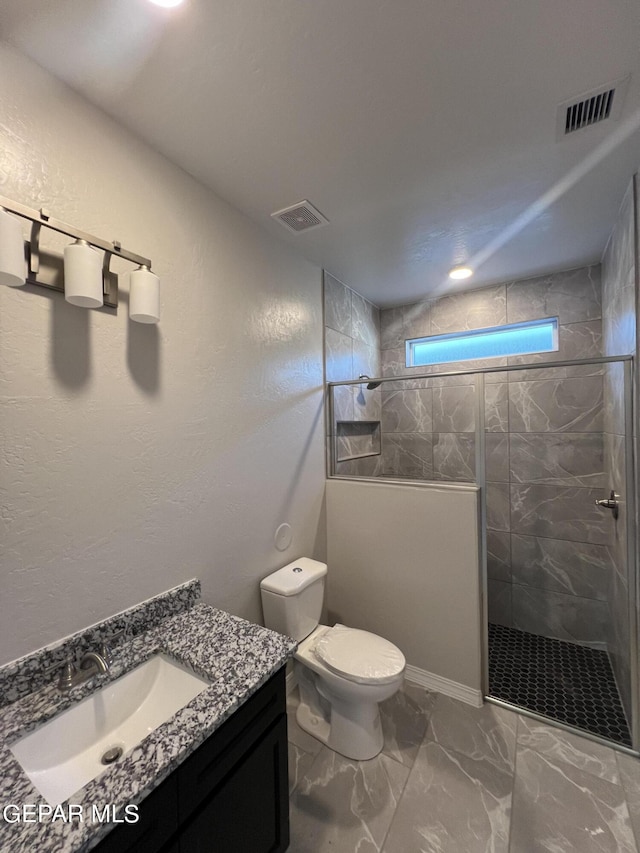 3720 Hill Top Place, El Paso, TX 79938 - bathroom featuring vanity, walk in shower, and marble look tile flooring