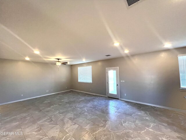 3720 Hill Top Place, El Paso, TX 79938 - spare room featuring ceiling fan and stone finish flooring